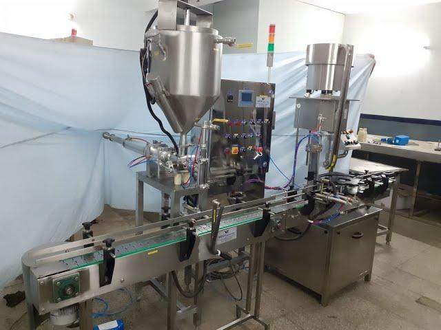 AUTOMATIC GHEE JAR FILLING MACHINE BY VED ENGINEERING NOIDA