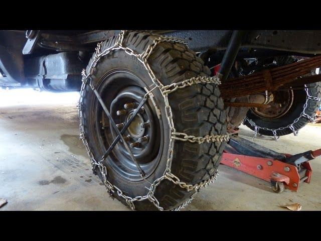 Installing snow tire chains - Heavy duty cleated v-bar chains on my plow truck