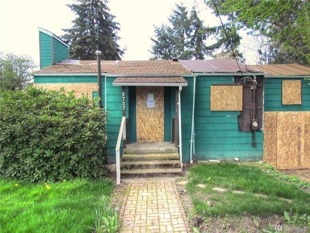 Flip this house!  Boarded up Seattle home up for sale at $450k