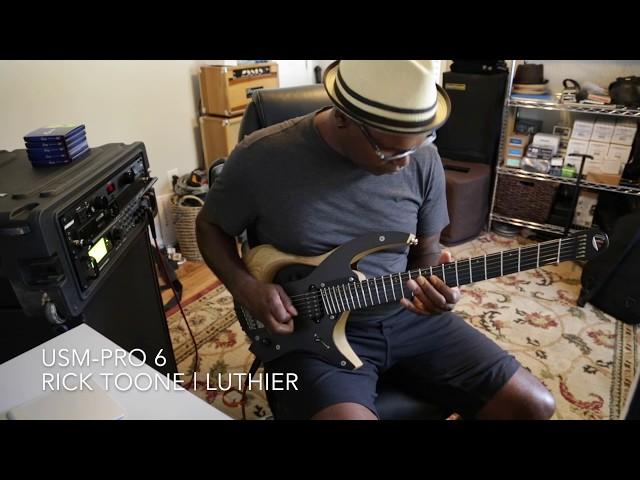 Ede Wright plays Rick Toone USM-Pro 6 guitar.