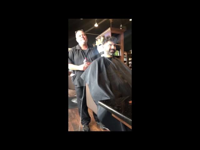 Men's barber styling with old style razor shaving.