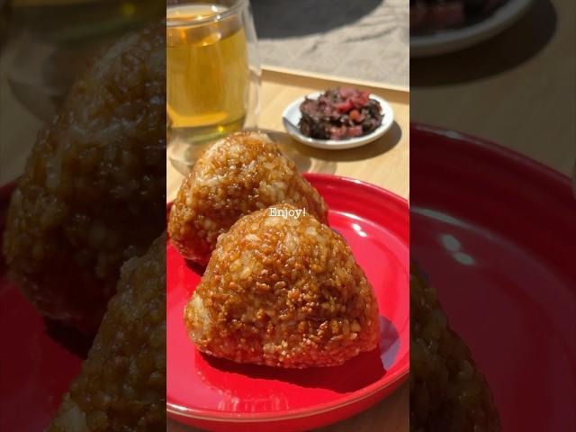 Probably not good manners holding the onigiri with chopsticks, but hey—they keep your hands clean!