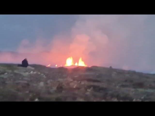 Dangerous fissures (ancient tectonic faults) close the eruption site. Volcano seen erupting across!