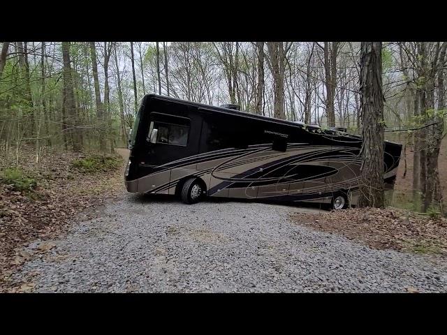 Driving a brand new 402ts diesel sportscoach pusher up a steep driveway.