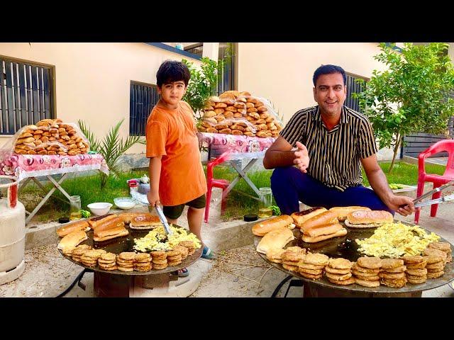 Distributing Burgers Made with Egg & Shami Kabab