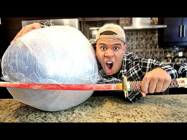 EXPERIMENT Glowing 1000 degree KATANA VS GIANT PLASTIC WRAP BALL! (10,000 LAYERS)