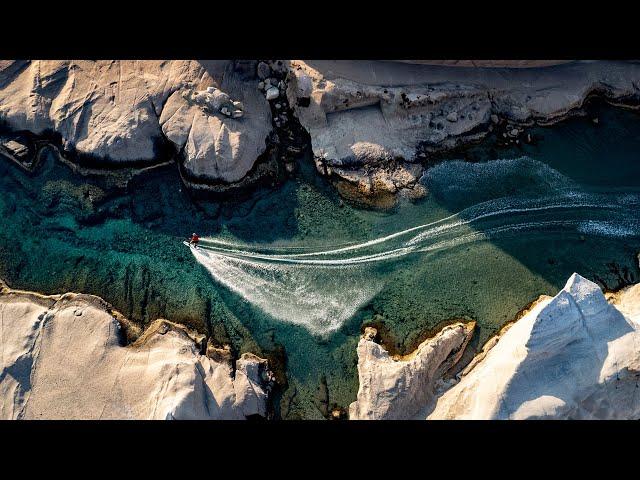 Nikolas Plytas Rides Milos' Turquoise Coast Among Lunar-Like Landscape