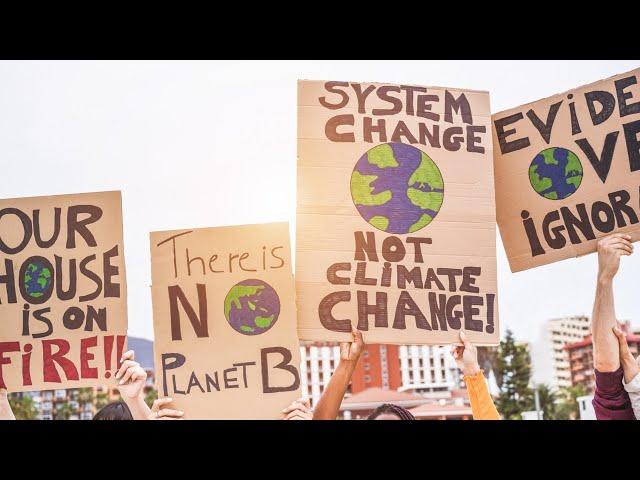 Climate protesters disrupt Berlin Marathon with orange paint