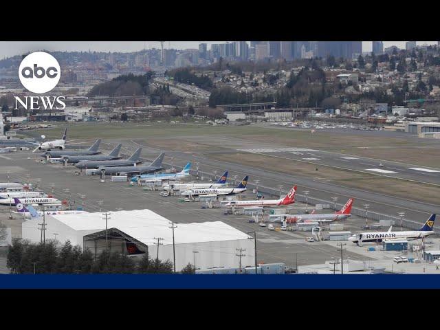 Unruly plane passenger tried to open emergency door, officials say