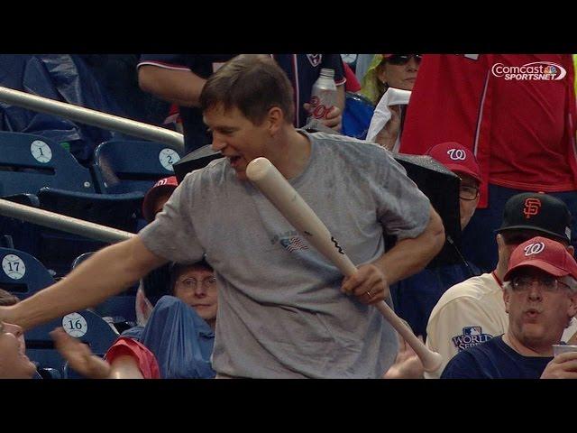 Fan catches bat on the fly, gets a kiss