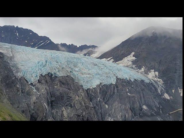 Stunning helicopter flight over Knik Glacier to dog sledding camp in Alaska