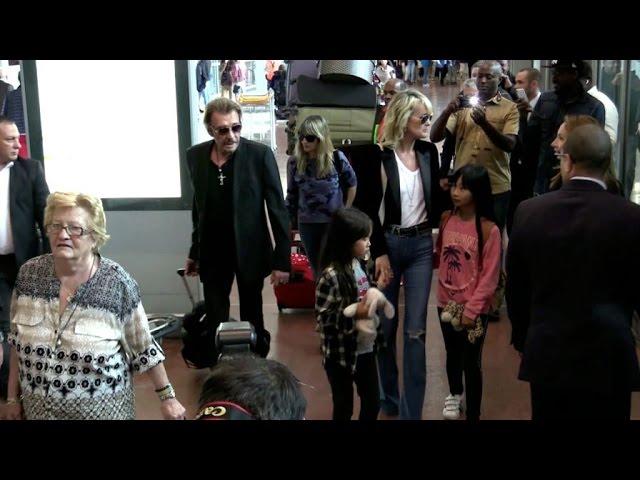 EXCLUSIVE: Johnny Hallyday, Laetitia, Jade and Joy arriving at Paris airport