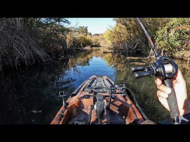 Fishing chilly backwaters in a small kayak