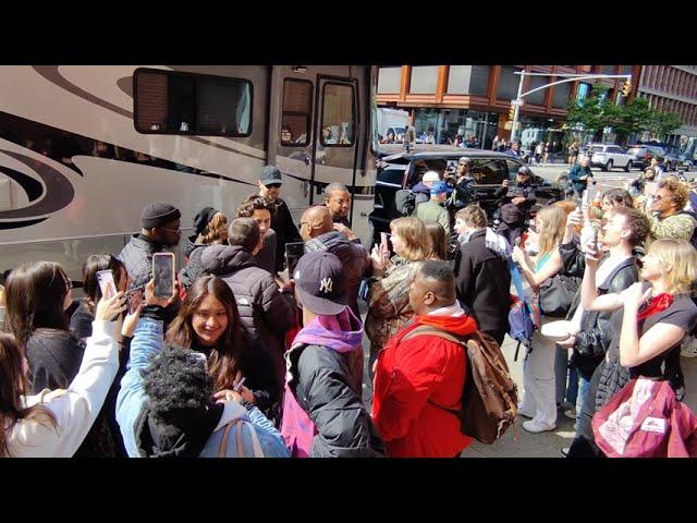 Timothee Chalamet take selfies with fans while filming a Chanel commercial in New York City