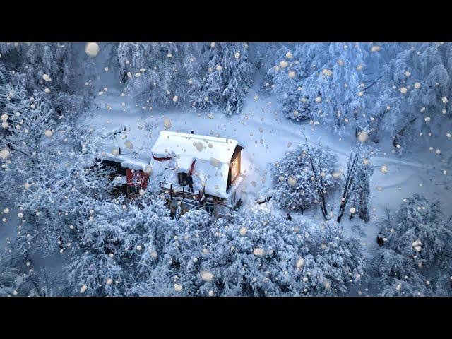 A man spends the night in an abandoned house, cleans garbage and cooks food