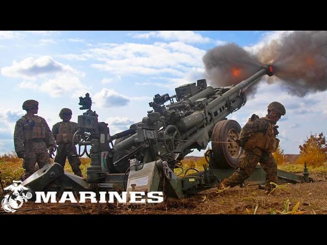 US Marine Corps. Powerful M777 howitzers during military training, Hokkaido, Japan.