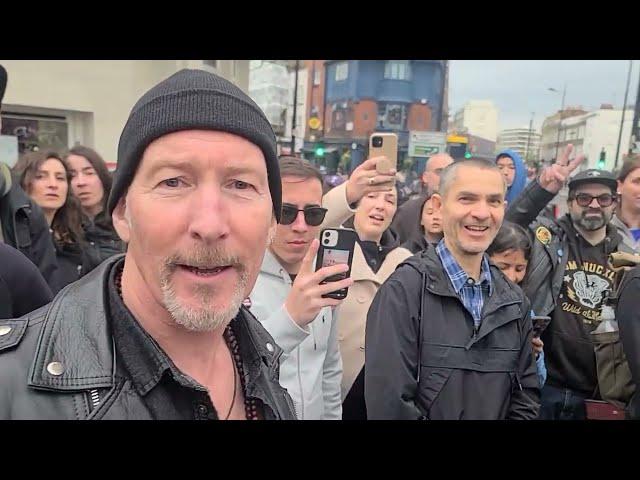 "Bono & the Edge" invited to sing with street buskers in London.  Or are they tribute artists?