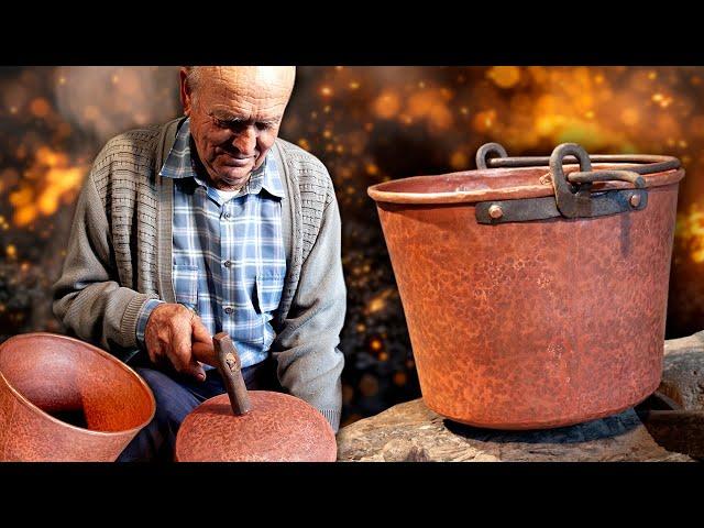 The boilermaker. Transformation of a copper sheet into a handmade cauldron with the blow of a hammer