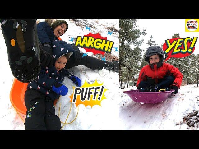 Alonso Crazy Cars family playing in the snow with sleds