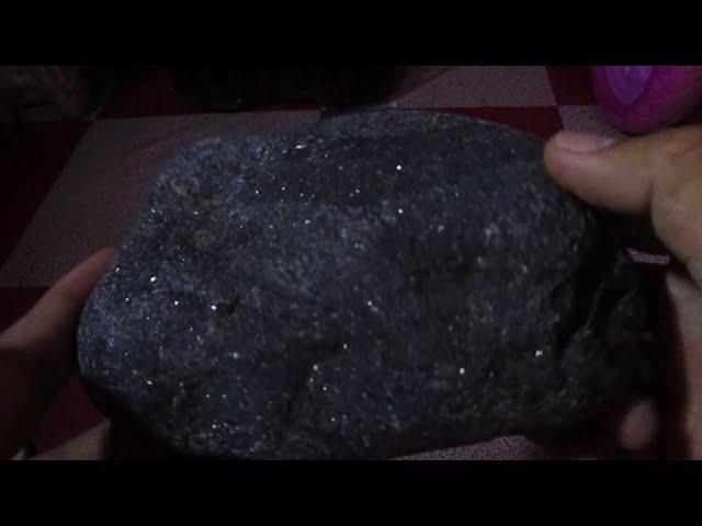 sparkling black rare stone discovered during digging....what type of rock is this?