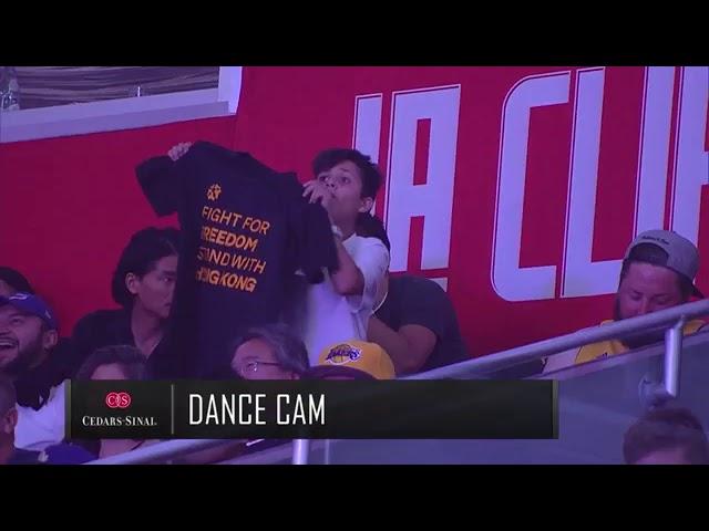 Kid baits NBA camera and flashes free Hong Kong shirt