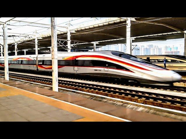 350kph through the station at FULL SPEED. Futuristic and incredible Chinese High Speed Train.