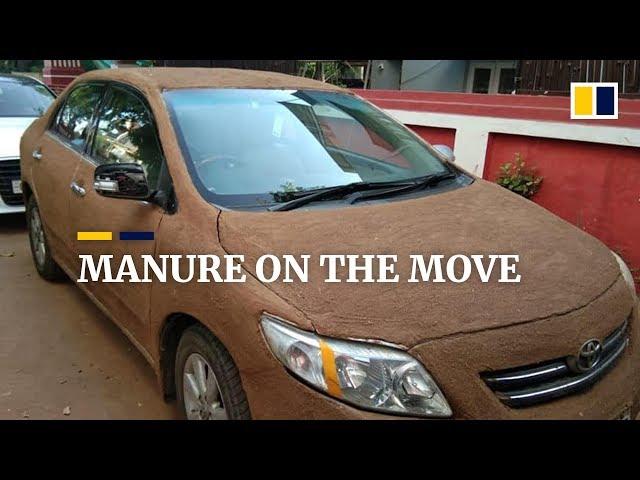 Indian woman covers her car in cow dung to avoid scorching heat