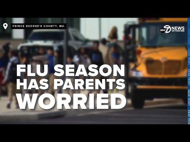 Elementary school parents hold little ones close after 2 young student flu deaths