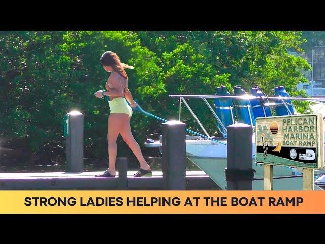 STRONG LADIES HELPING AT THE BOAT RAMP