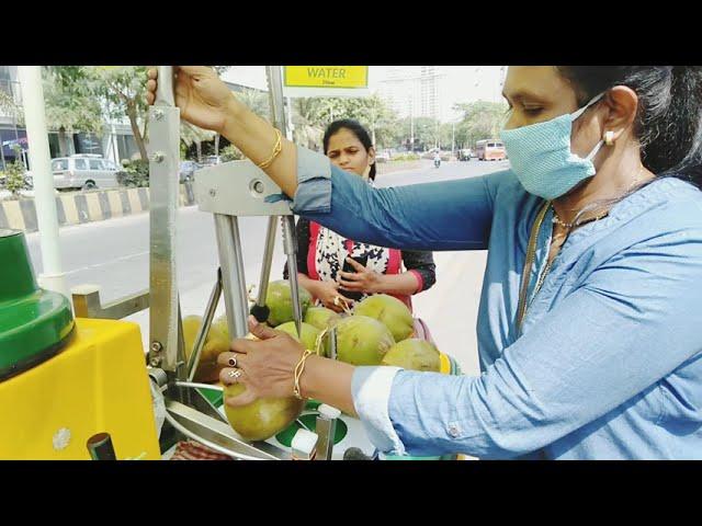 self employed women selling Chilled Coconut water using  advanced Cart- per unit 50 rupees