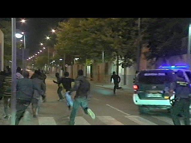 African migrants storm Spanish border fence