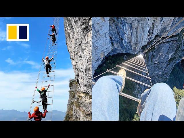 Daredevil cliff climbing experience at Chinese mountain thrills tourists