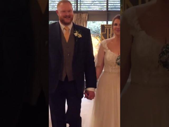 bride and groom walk up the aisle