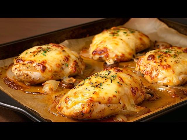 Perfect dinner: chicken fillet with mushrooms, onions and cheese in the oven 