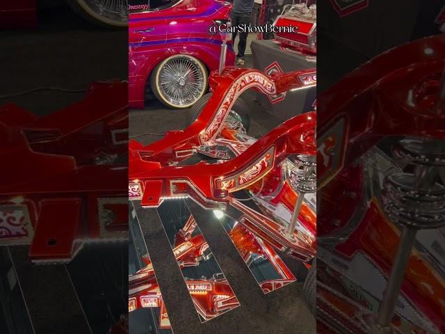 Chassis of a ‘62 Impala in the Hoppos Hydraulics Booth at the 2023 SEMA Show.