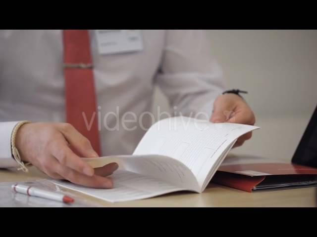 Businessman Exploring Info From Open Booklet - Stock Footage | VideoHive 15169686