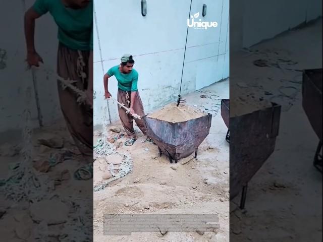 Man pulls heavy sand load: the power of simple machines