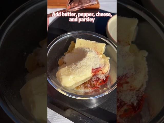 A gentleman is making garlic bread 