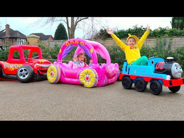 Max and Katy playing with Ride-on Toy Cars