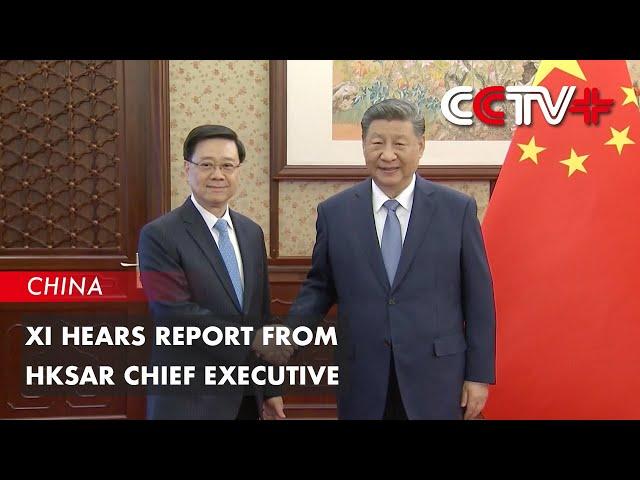 Xi Hears Report from HKSAR Chief Executive