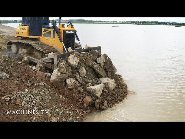 Mind Blow Operator Bulldozer Moving Stone Into Water Preparing Base Boundary Landfill In Big Lake