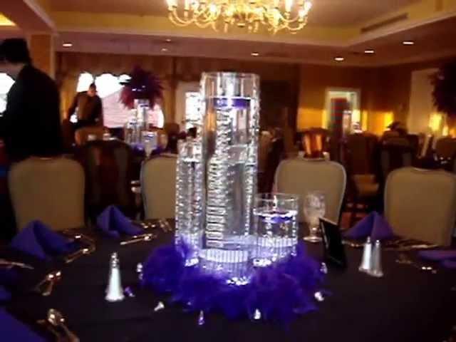 Floating Candle Centerpieces in Purple by Sweet 16 Candelabras