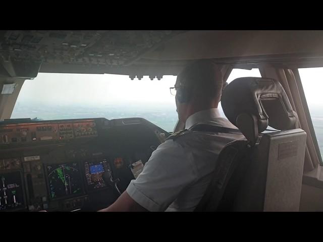 BOEING 747 400,  F/O  pilot flying...only by the spoilers deployment you know A/C landed ..SO SOFT