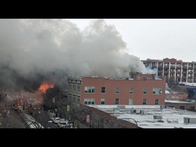 Firefighters battle massive four-alarm fire on Main Street