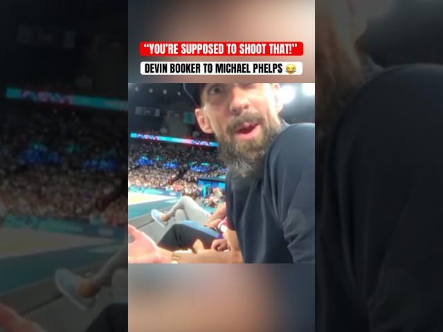 Booker and Michael Phelps at the USA Women’s Basketball game 