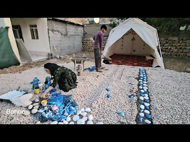 Banoo’s Artistic Touch: Painting River Stones to Decorate Her Village Home