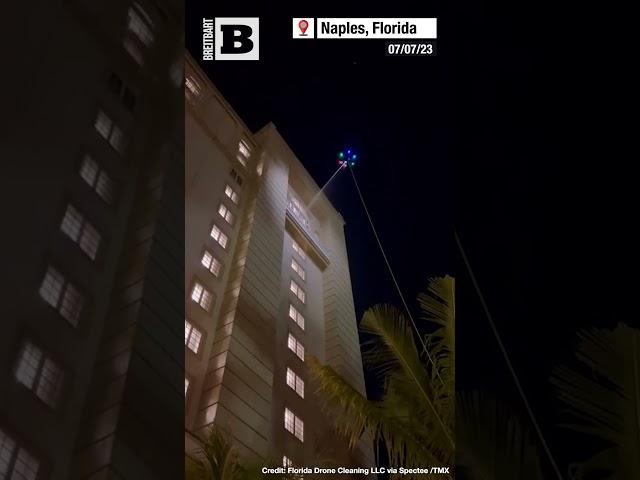 ALIEN WORKERS! Florida Business Uses UFO-Like Drone to Wash Windows