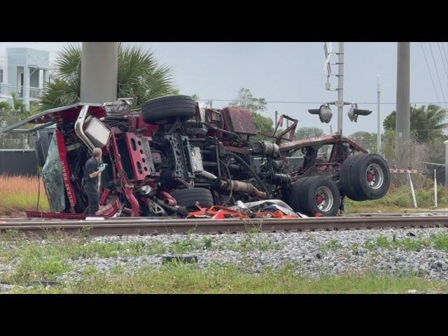 Train collides with fire truck in Florida; police say 3 firefighters and several passengers hurt