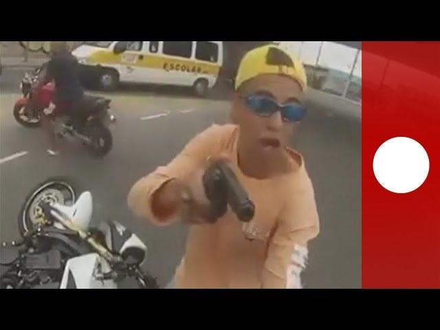 Graphic footage: Brazil cop guns down motorbike hijacker in Sao Paolo (caught on helmet cam)