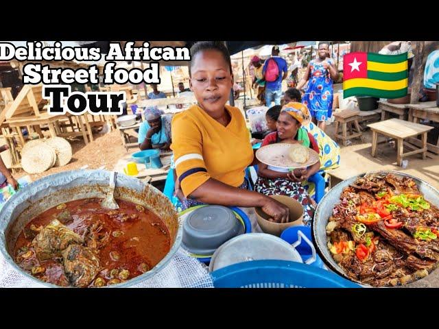 Trying the cheapest and most delicious street food in Akodessewa market lomé Togo  west Africa 